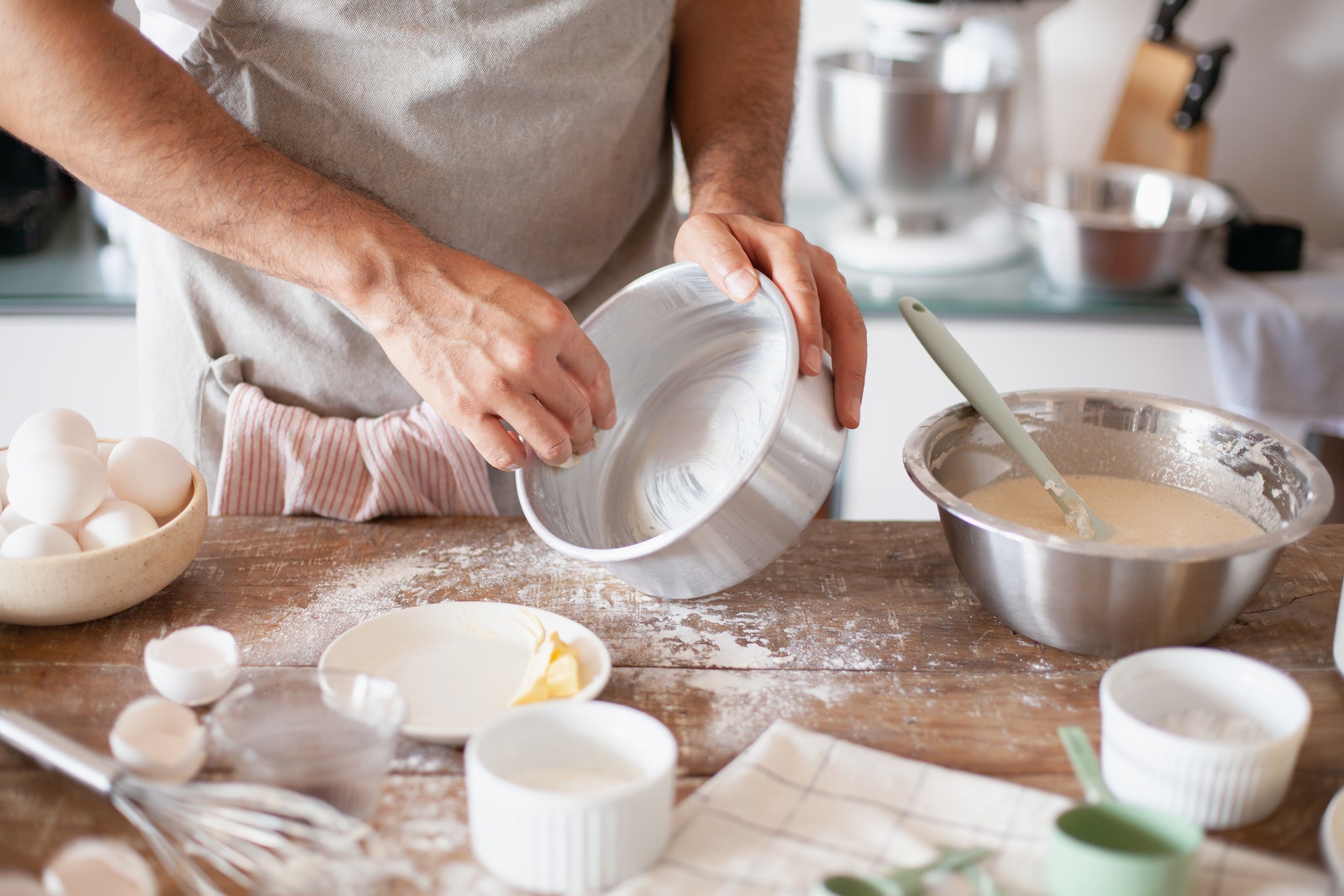 Person Greasing a Baking Pan