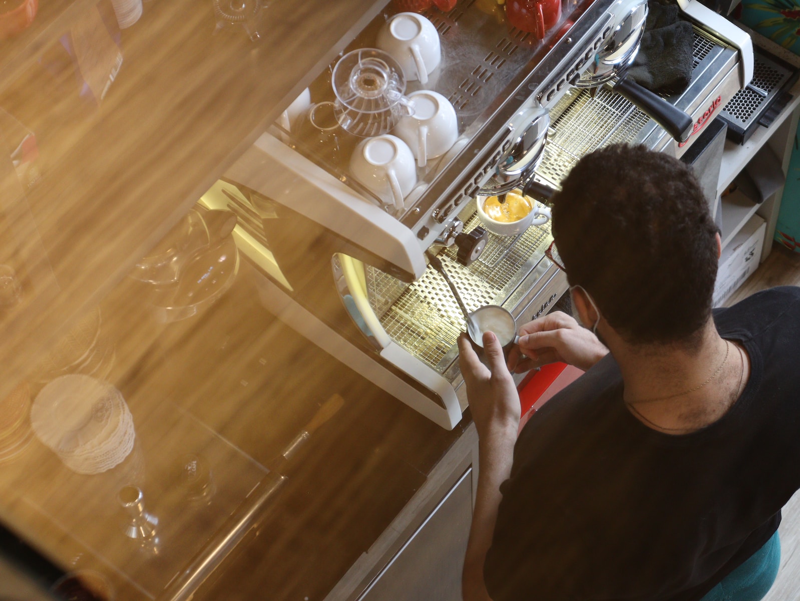 a man is looking at the dishes in the dishwasher